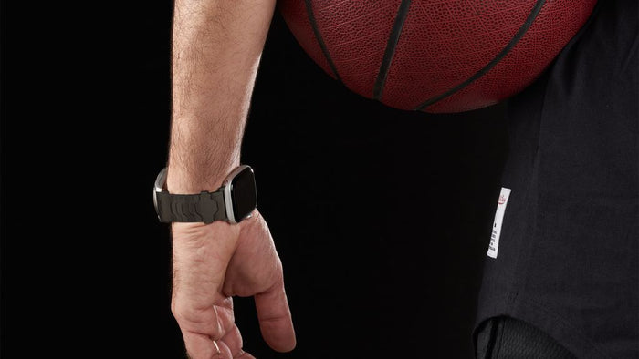 Hands adjusting modular strap on wrist