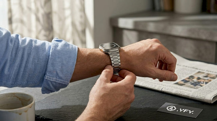 Man using smartwatch at breakfast table