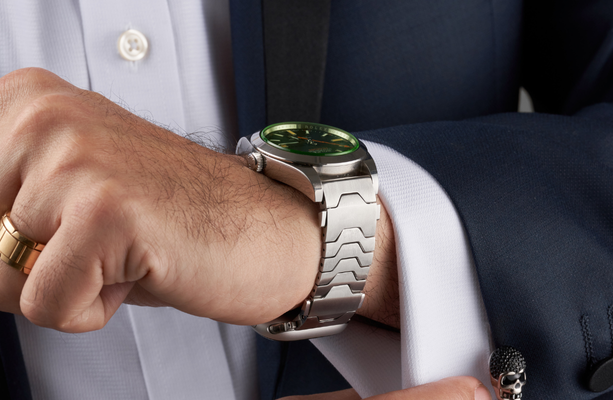 Smartlet Classic adapter on a leather strap with Apple Watch positioned toward the forearm in a professional office context