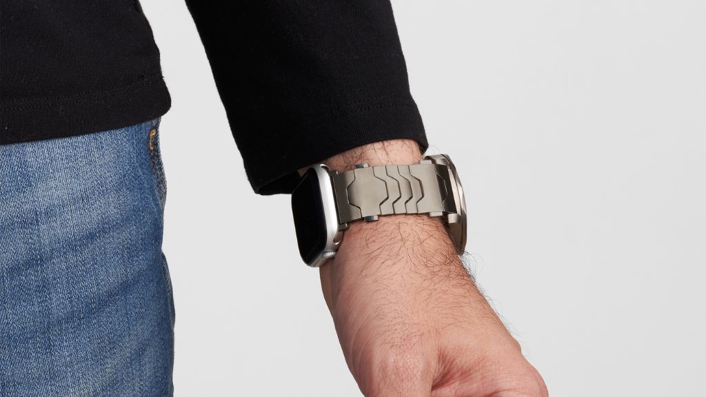 Smartlet adapter on wrist with Rolex Explorer I and Apple Watch during an evening in a hotel setting