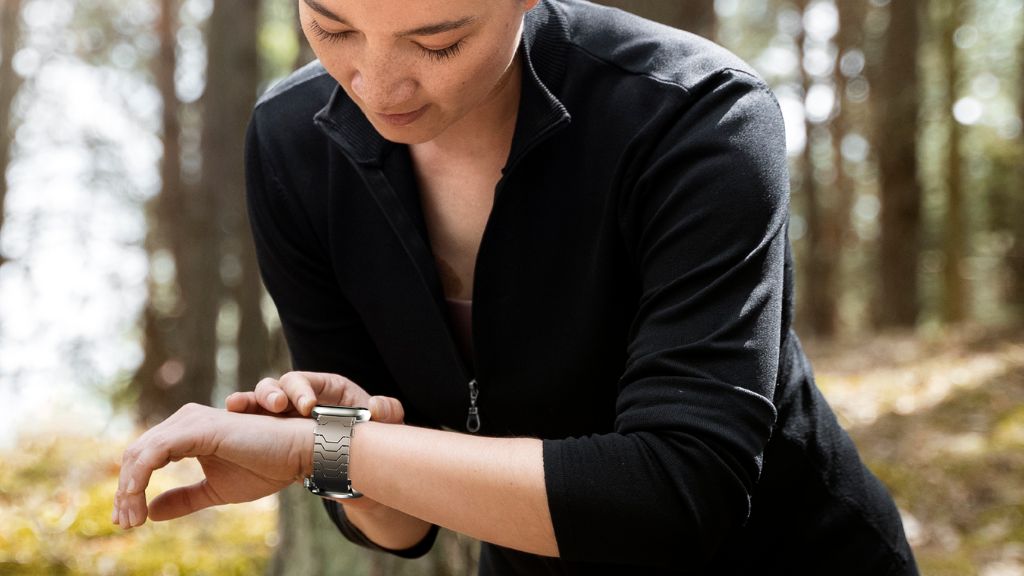 Smartlet Titanium adapter assembled with Apple Watch on the wrist alongside a mechanical watch - step by step setup result