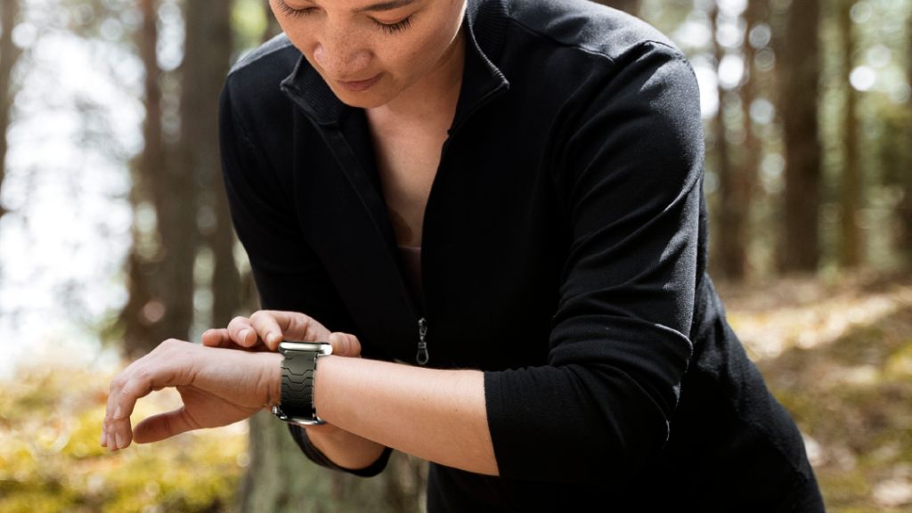 Smartlet Shadow version worn outdoors with Apple Watch and a field-style mechanical watch on a NATO strap