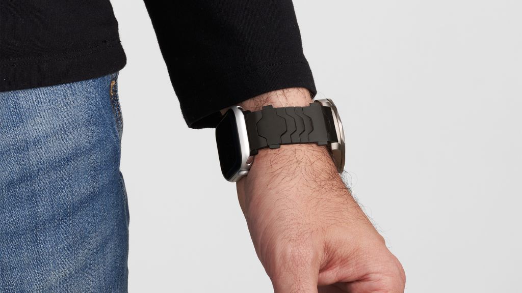 Smartlet Shadow adapter worn with a dress watch and Apple Watch on the same wrist in a business setting, showing how both watches coexist discreetly